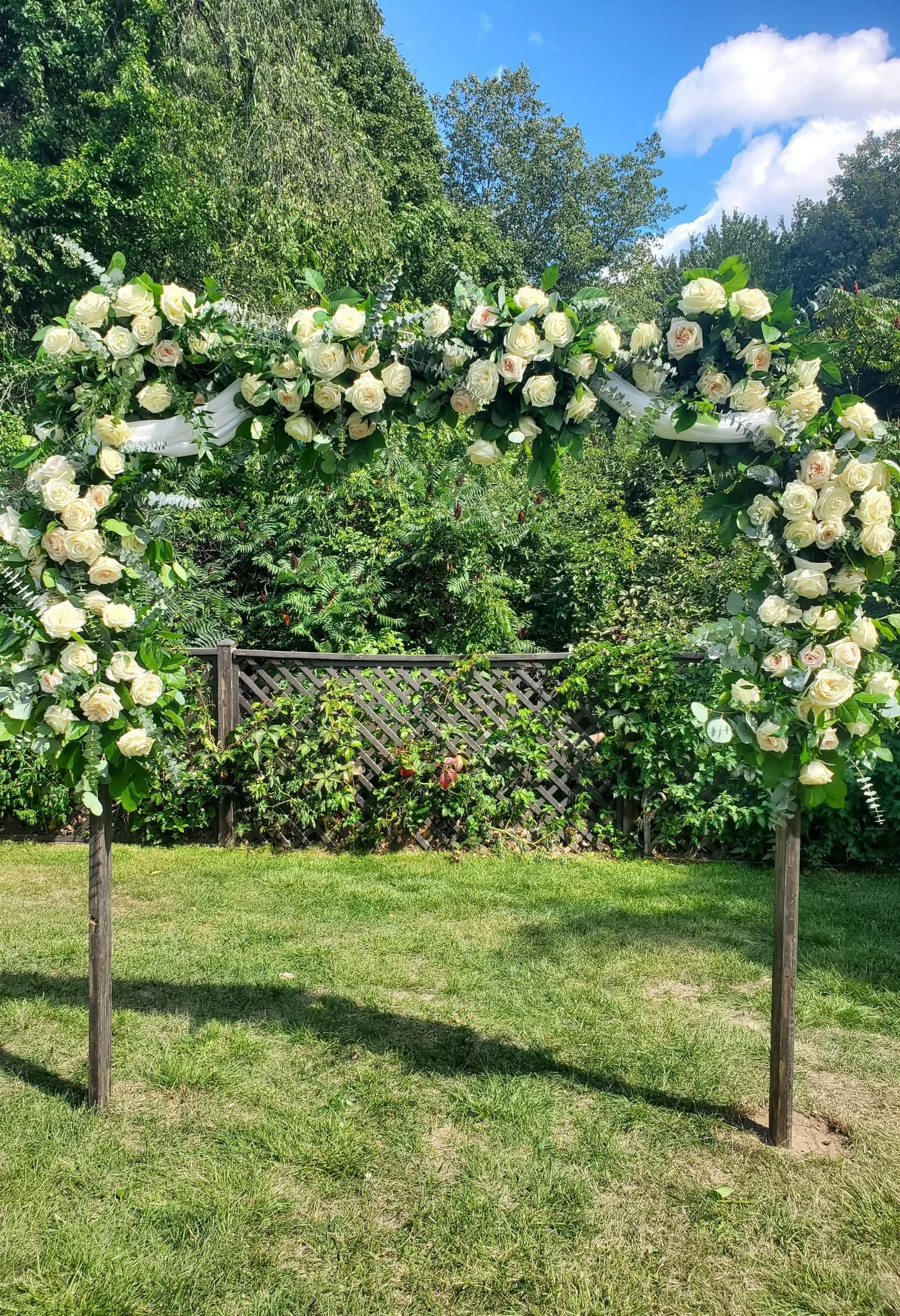 Outdoor wedding floral arch